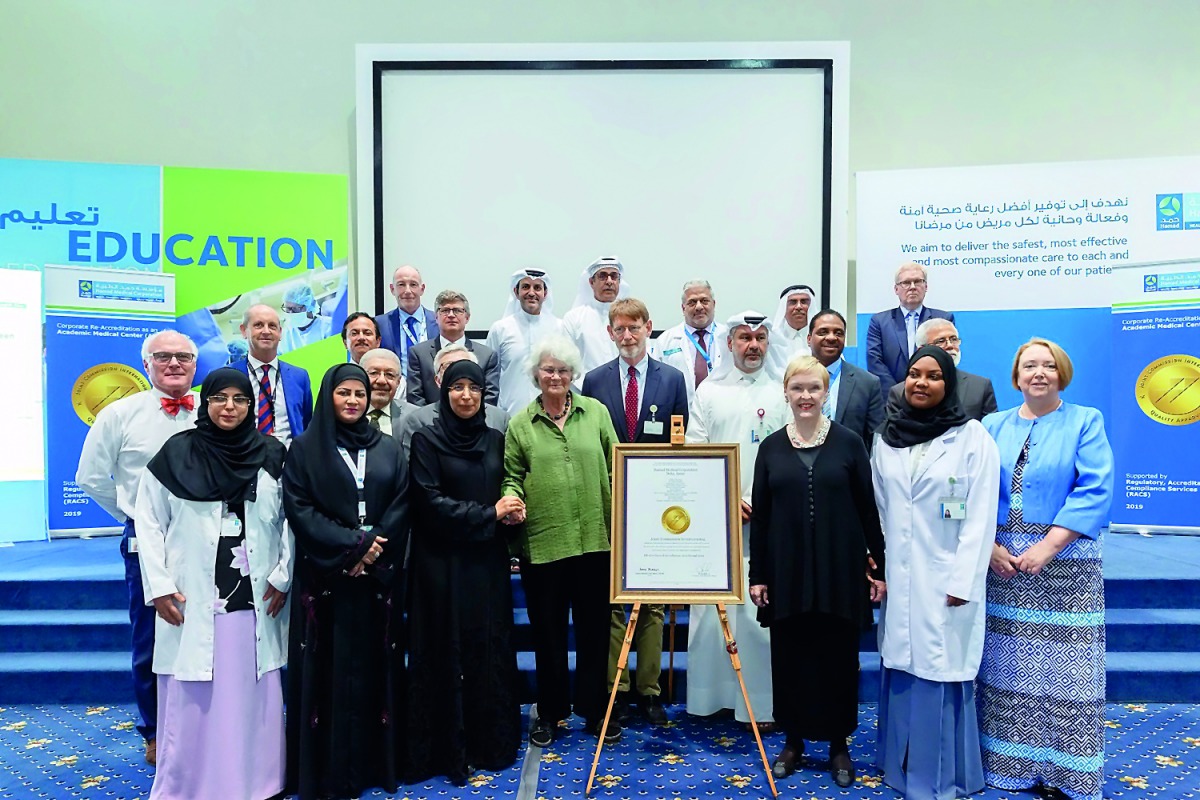 Minister of Public Health, Dr Hanan Mohamed Al Kuwari, and HMC leaders and facility CEOs with the team from Joint Commission International who carried out the accreditation surveys across HMC, pose for a group picture.