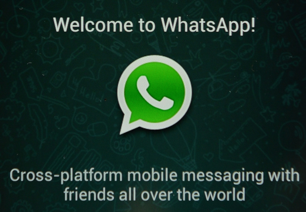 (FILES) This file photograph taken on February 20, 2014, shows the logo of WhatsApp, the popular messaging service, seen on a smartphone in New York. AFP / Stan Honda