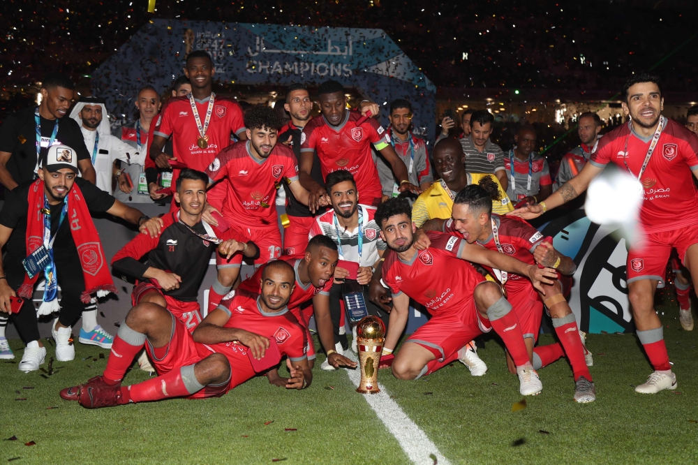Duhail's players celebrate with the trophy after winning the Amir Cup final football match between Al Sadd and Al Duhail at the Al Wakrah Stadium in the Qatari city of Al Wakrah on May 16, 2019. / AFP / Karim Jaafar 