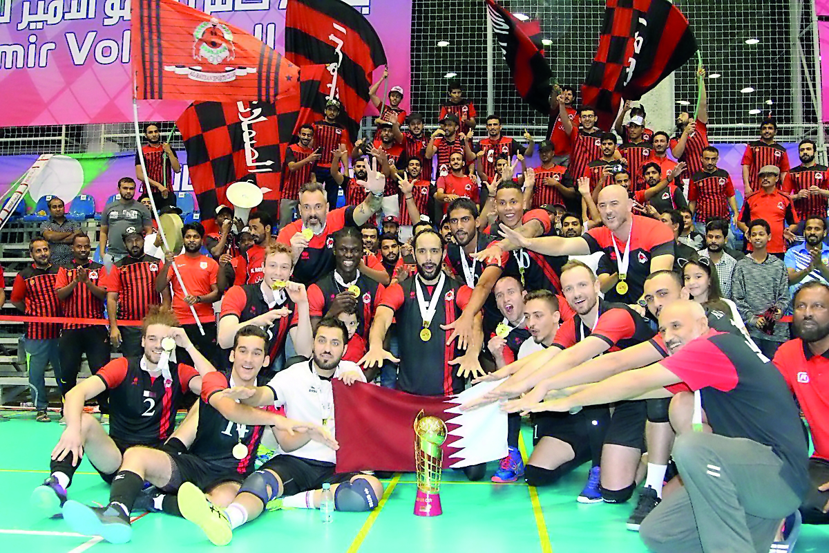 Al Rayyan volleyball team players and officials are seen in this photograph after winning the Amir Cup final against Police. 