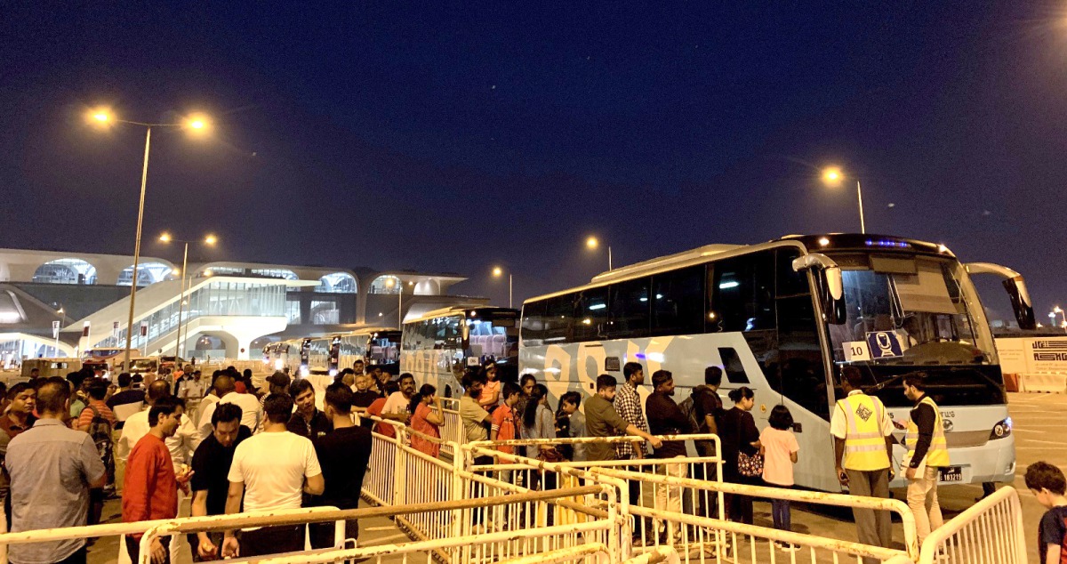 Karwa buses transporting people from metro station to Al Janoub Stadium.