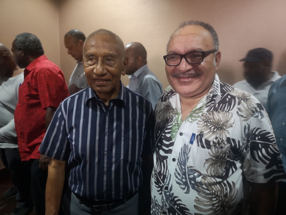 Papua New Guinea Prime Minister Peter O'Neil (R) and member of parliament Julius Chan (L) attend a function in Port Moresby on May 26, 2019. O'Neill annouced his resignation making way for Julius Chan to return as prime minister local media reported. / AF