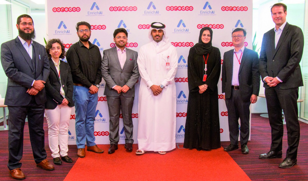 The officials of Ooredoo Qatar and EnrichAI during the event announcing the partnership. 