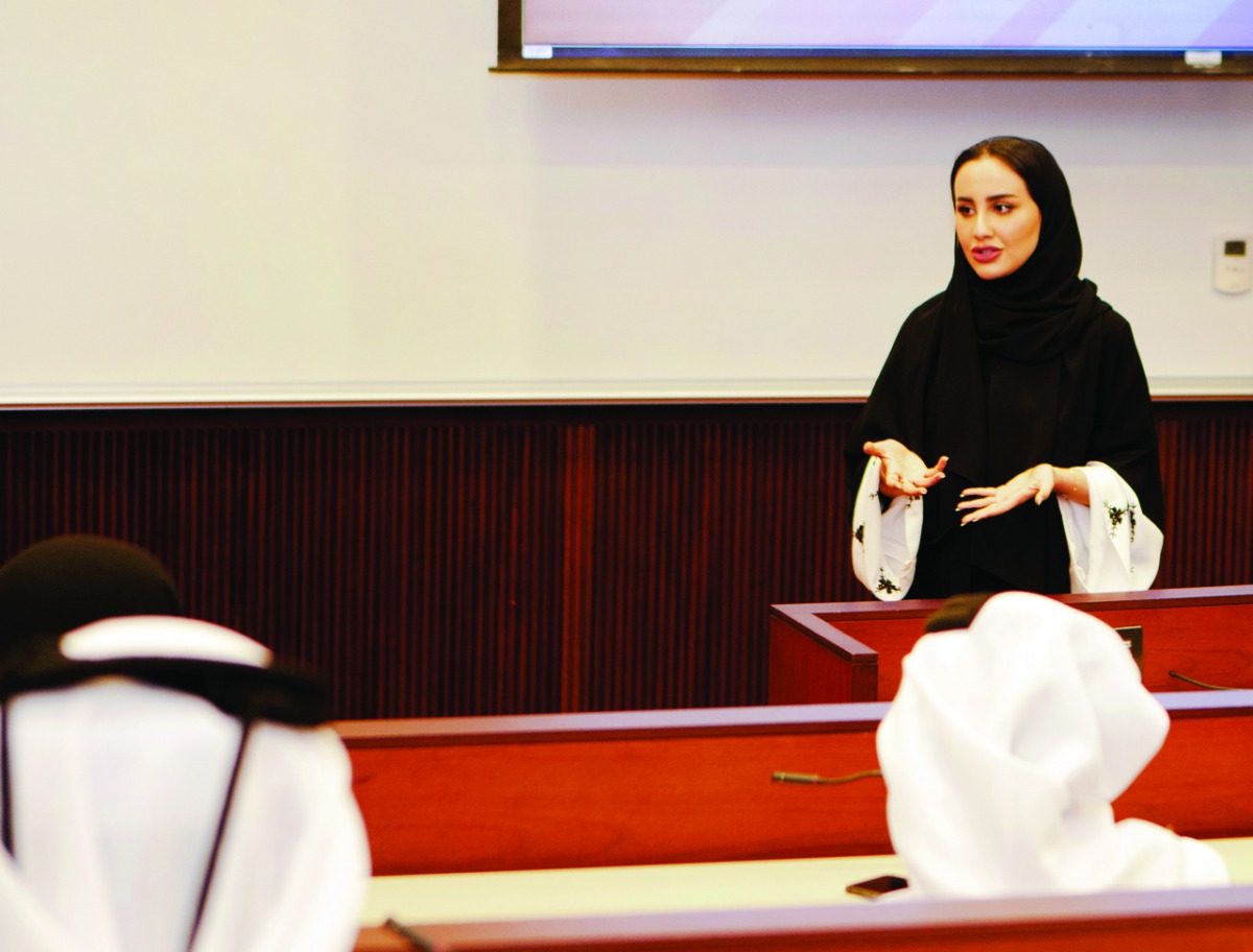 Dana Khalid Al Anzy giving presentation about the 24th Session of The Youth Assembly.