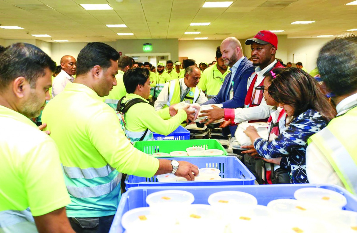 Iftar food boxes being distributed to employees at HIA.