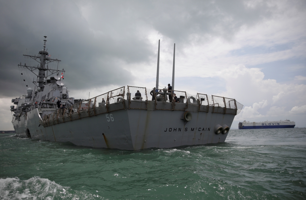 FILE PHOTO: The U.S. Navy guided-missile destroyer USS John S. McCain is seen after a collision, in Singapore waters August 21, 2017. REUTERS/Ahmad Masood/File Photo
