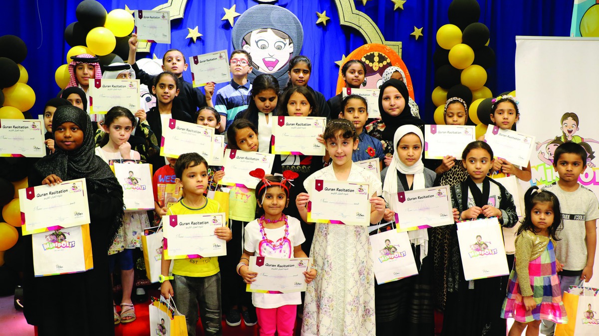 The participants of the Holy Quran recitation competition by Minipolis pose for a group photo.