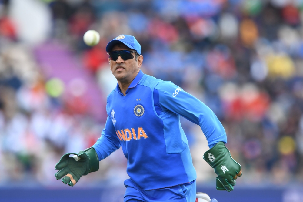 India's Mahendra Singh Dhoni fields during the 2019 Cricket World Cup group stage match between South Africa and India at the Rose Bowl in Southampton, southern England, on June 5, 2019.  AFP / Dibyangshu Sarkar