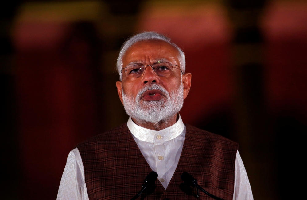 FILE PHOTO: India's Prime Minister Narendra Modi speaks to the media after his meeting with President Ram Nath Kovind, to stake claim to form the new government at the Presidential Palace in New Delhi, India May 25, 2019. REUTERS/File Photo