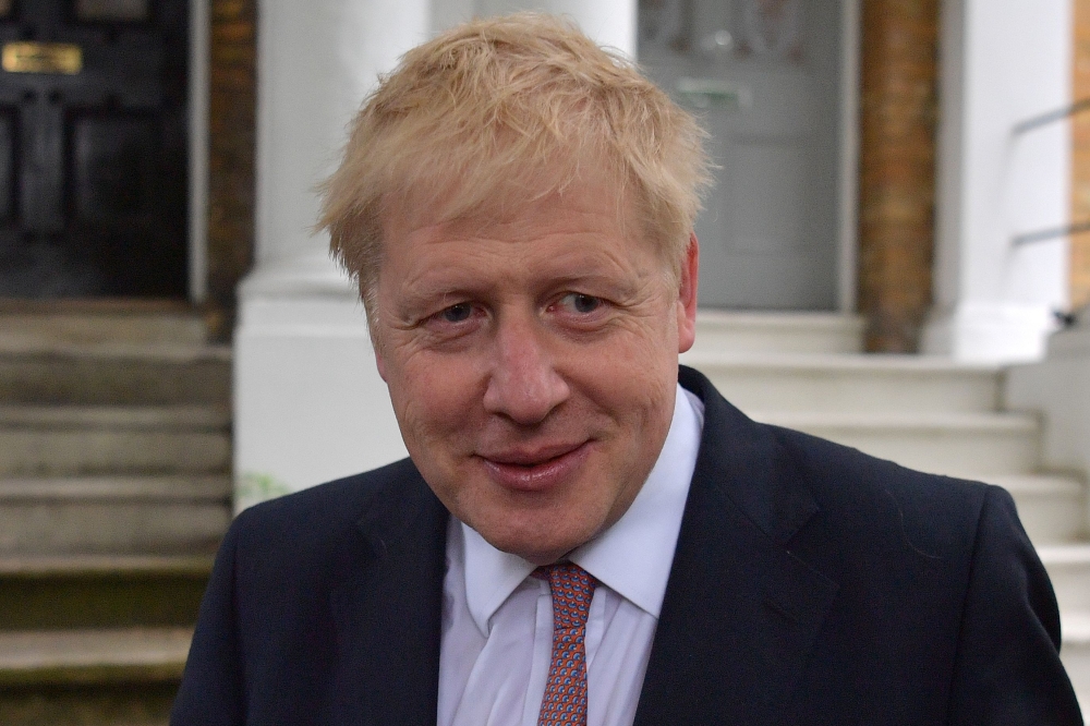 Conservative MP Boris Johnson leaves a house in London on June 7, 2019.  AFP / Daniel LEAL-OLIVAS