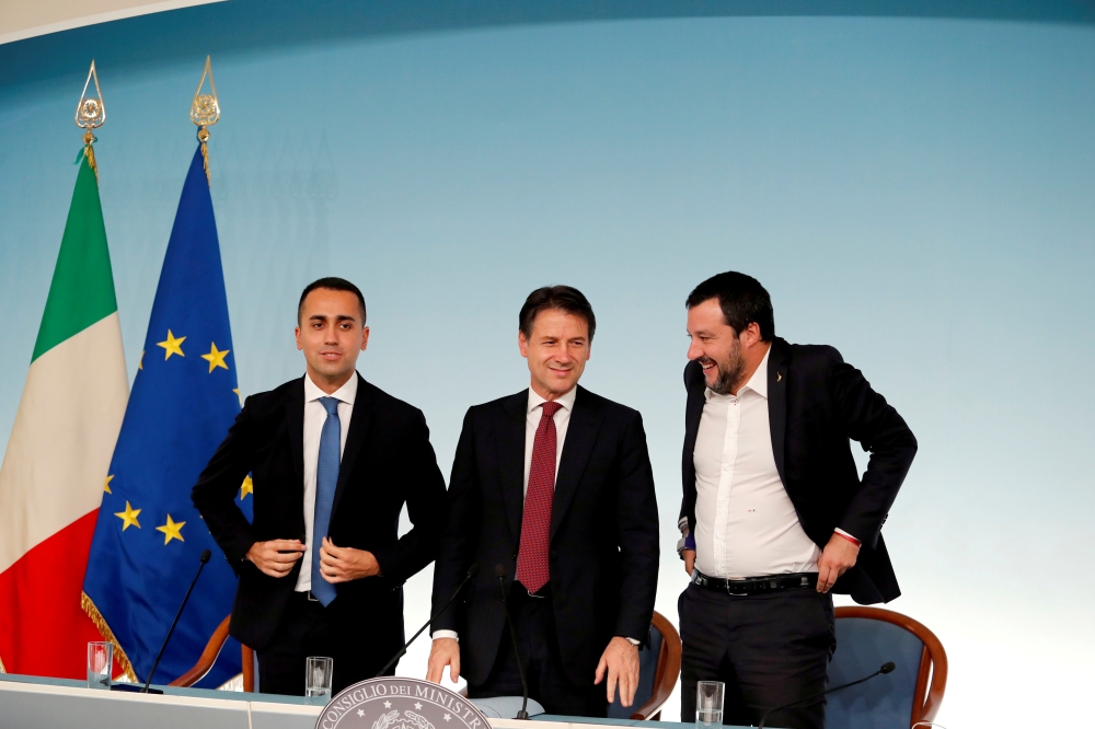 FILE PHOTO: Italy's Minister of Labor and Industry Luigi Di Maio, Prime Minister Giuseppe Conte and Interior Minister Matteo Salvini leave at the end of a news conference after a cabinet meeting at Chigi Palace in Rome, Italy, October 20 2018. REUTERS/Rem