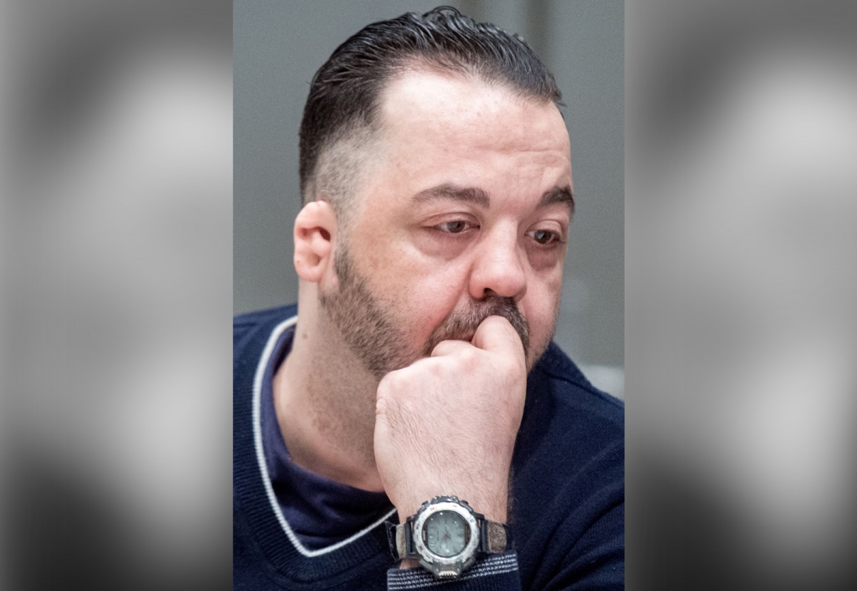FILE PHOTO:  Former nurse Niels Hoegel, accused of killing more than 100 patients in his care, waits at court for his verdict at court in Oldenburg, northern Germany.   ALTERNATIVE CROP / AFP