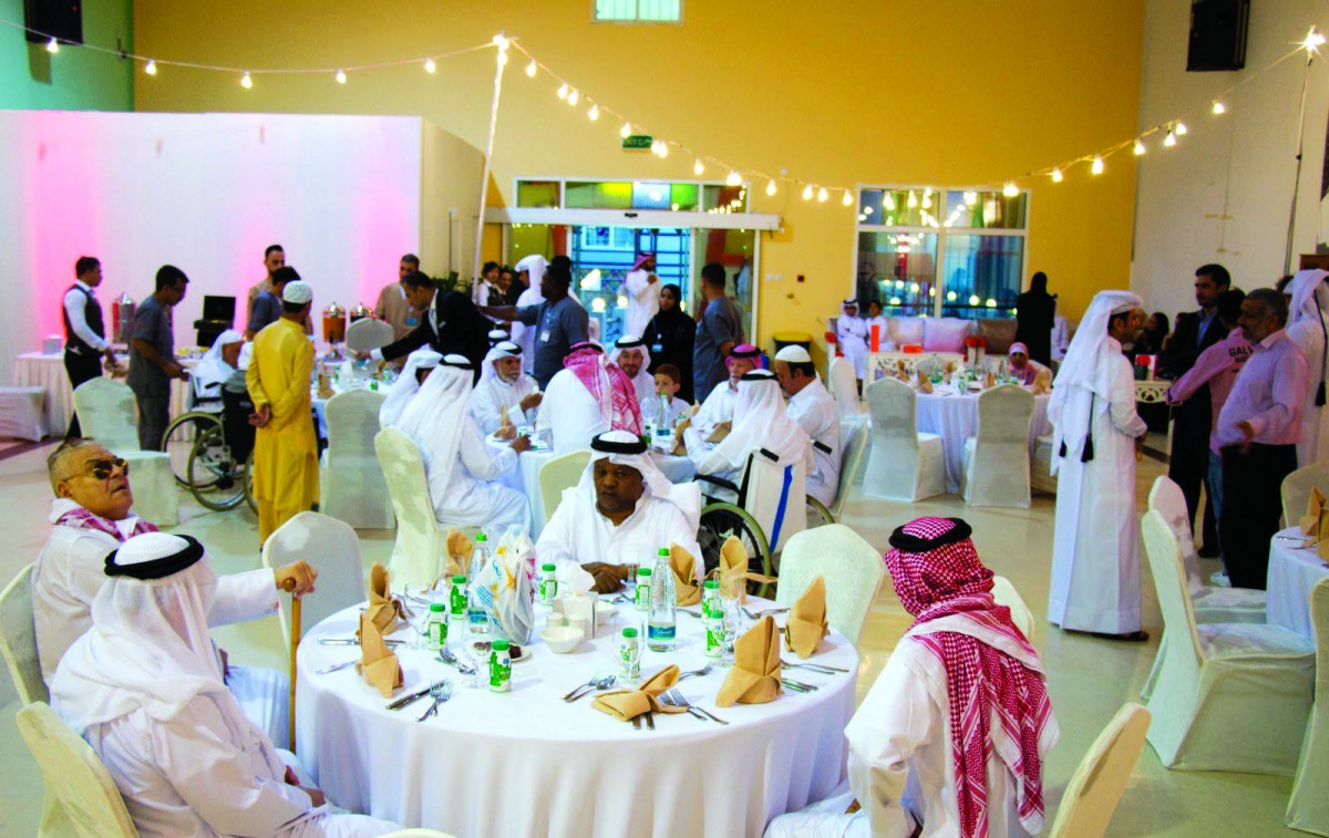 Guests and officials during a visit of Ooredoo Qatar volunteers to Ehsan Centre.