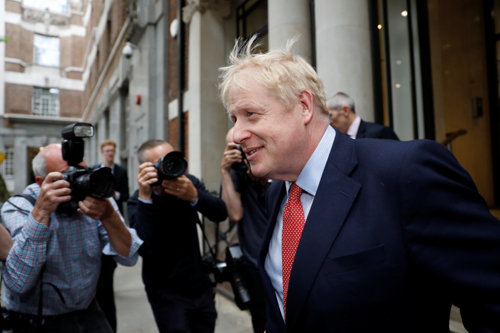 Boris Johnson, leadership candidate for Britain's Conservative Prime Minister, leaves a hustings event in London, Britain, June 21, 2019. REUTERS/Peter Nicholls