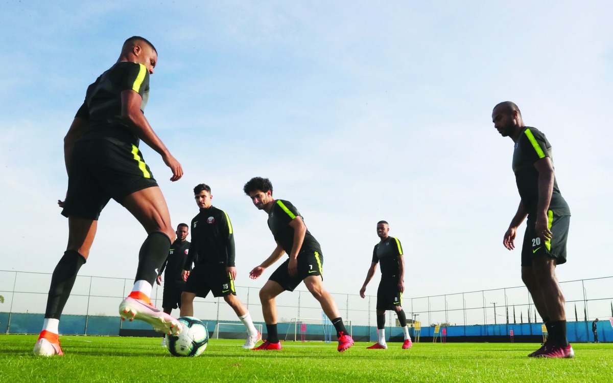 Qatari players take part in a practice session in Porto Alegre, Brazil yesterday, on the eve of their Copa America match against Argentina.