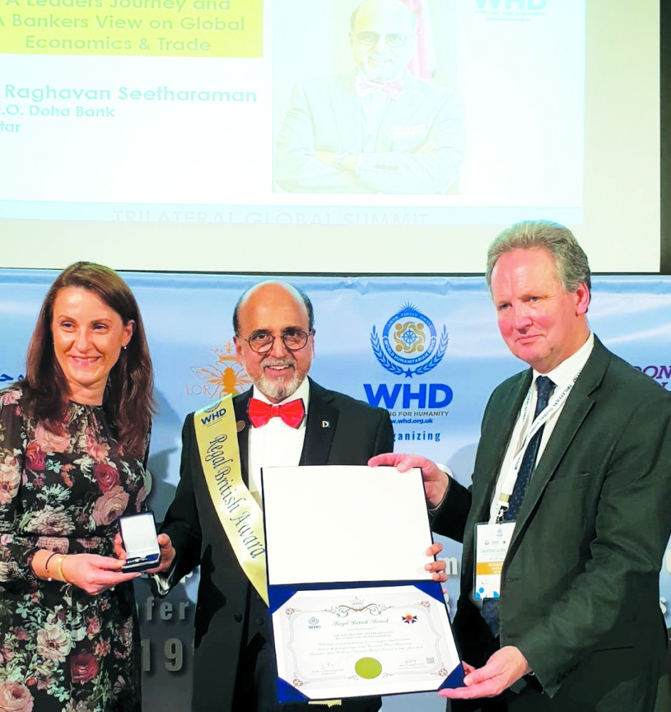 Dr. R Seetharaman, CEO, Doha Bank (centre) receiving the “Best CEO of the Century for Peace and Humanity” Award by WHD, in London.