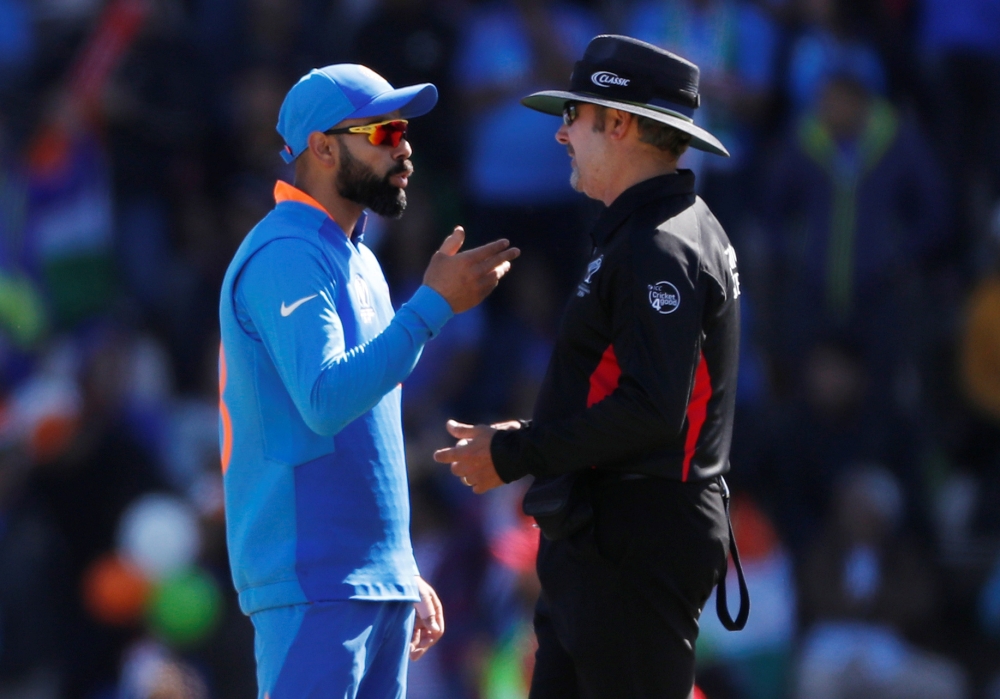 India's Virat Kohli talks to umpire Richard Illingworth Action Images via Reuters/Paul Childs