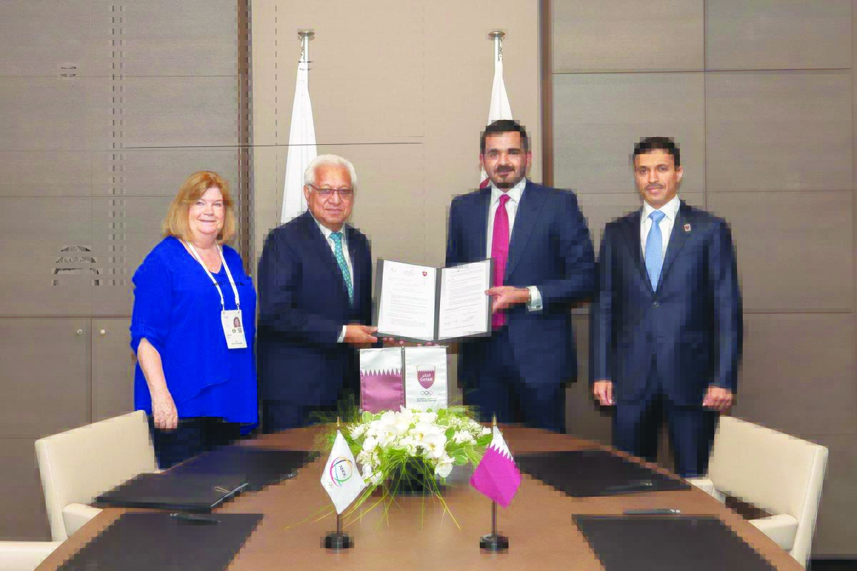  QOC President Sheikh Joaan and Secretary General of QOC, Jassim Al Buenain, pose for a photograph with Association of National Olympic Committees (ANOC) Senior Vice-President Robin Mitchel and ANOC Secretary General Gunilla Lindberg during an MOU signing