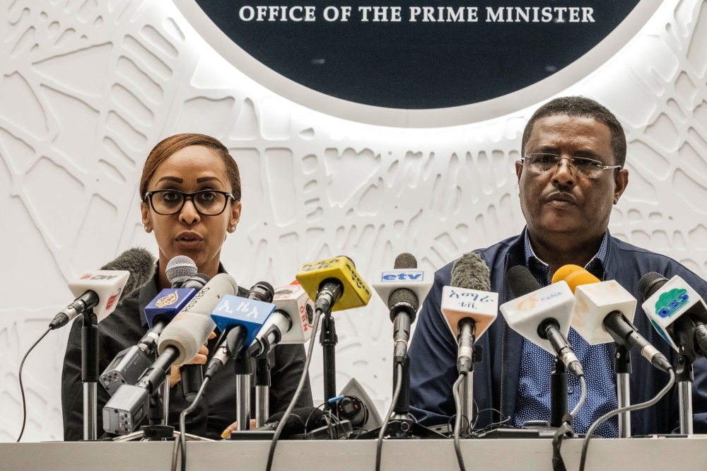 Ethiopia's Press Secretary Billene Seyoum (L) and spokesperson of the Primer Minister of Ethiopia Negussu Tilaaun, speak during a press conference, in Addis Ababa, on June 23, 2019. AFP / EDUARDO SOTERAS