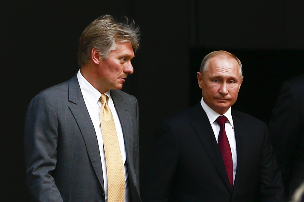 Russian President Vladimir Putin (R) and Russian Presidential Spokesman Dmitry Peskov. Sefa Karacan - Anadolu 