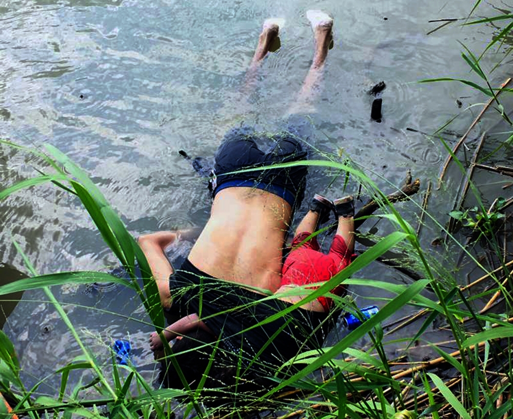 View of the bodies of Salvadoran migrant Oscar Martinez Ramirez and his daughter, who drowned while trying to cross the Rio Grande -on their way to the US- in Matamoros, state of Tamaulipas on June 24, 2019.  AFP