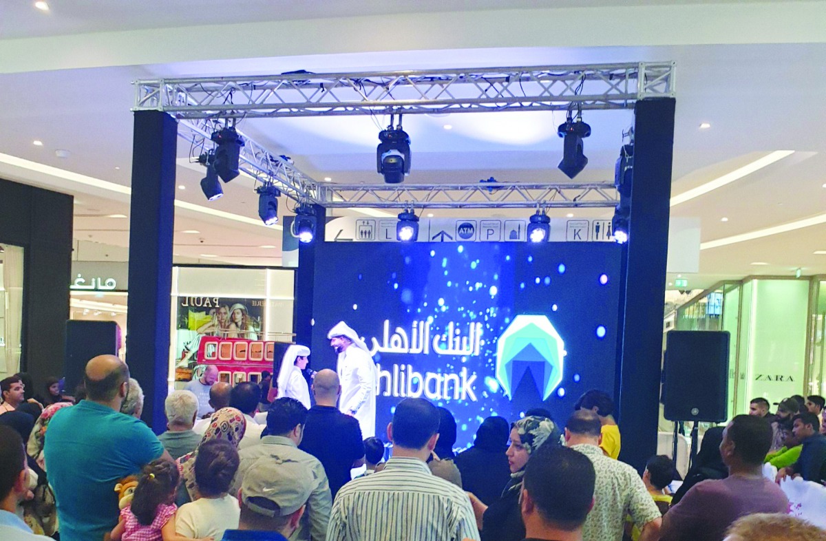 An Ahlibank official announcing the second winner of its QR1m Al Rabeh Savings Scheme prize at the Doha Festival City Mall on Thursday. 