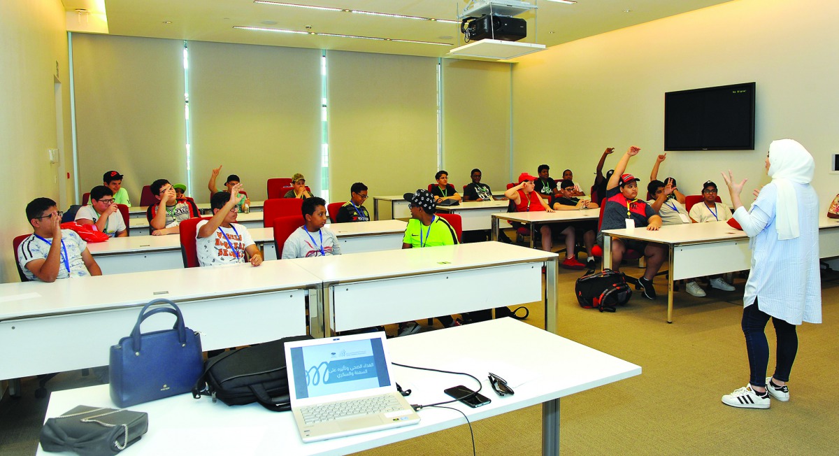 Riham Badoura, a dietician at the Qatar Diabetes Association, giving a presentation on ‘Obesity and Diabetes’ as part of 10th Diabetes Prevention Camp for boys, at the Student Centre, Education City, yesterday.  Pic: Salim Matramkot / The Peninsula