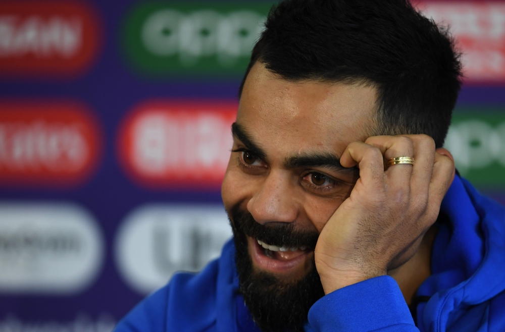 India's captain Virat Kohli addresses media representatives during a press conference at Old Trafford in Manchester, north-west England on July 8, 2019, ahead of their 2019 Cricket World Cup semi-final match against New Zealand. AFP / Dibyangshu Sarkar 