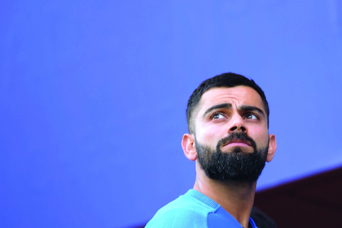 India's captain Virat Kohli reacts at the end of play during the 2019 Cricket World Cup first semi-final between New Zealand and India at Old Trafford in Manchester, northwest England, on July 10, 2019. AFP / Dibyangshu Sarkar