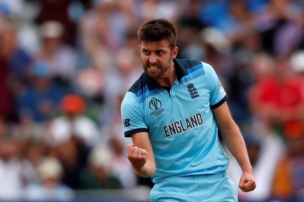 England's Mark Wood celebrates taking the wicket of Australia's Jason Behrendorff. (Action Images via Reuters/Andrew Boyers) 
