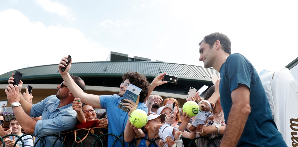 Switzerland's Roger Federer leaves the practice courts after a session on day ten of the 2019 Wimbledon Championships at The All England Lawn Tennis Club in Wimbledon, southwest London, on July 11, 2019. -(AFP / Adrian DENNIS)