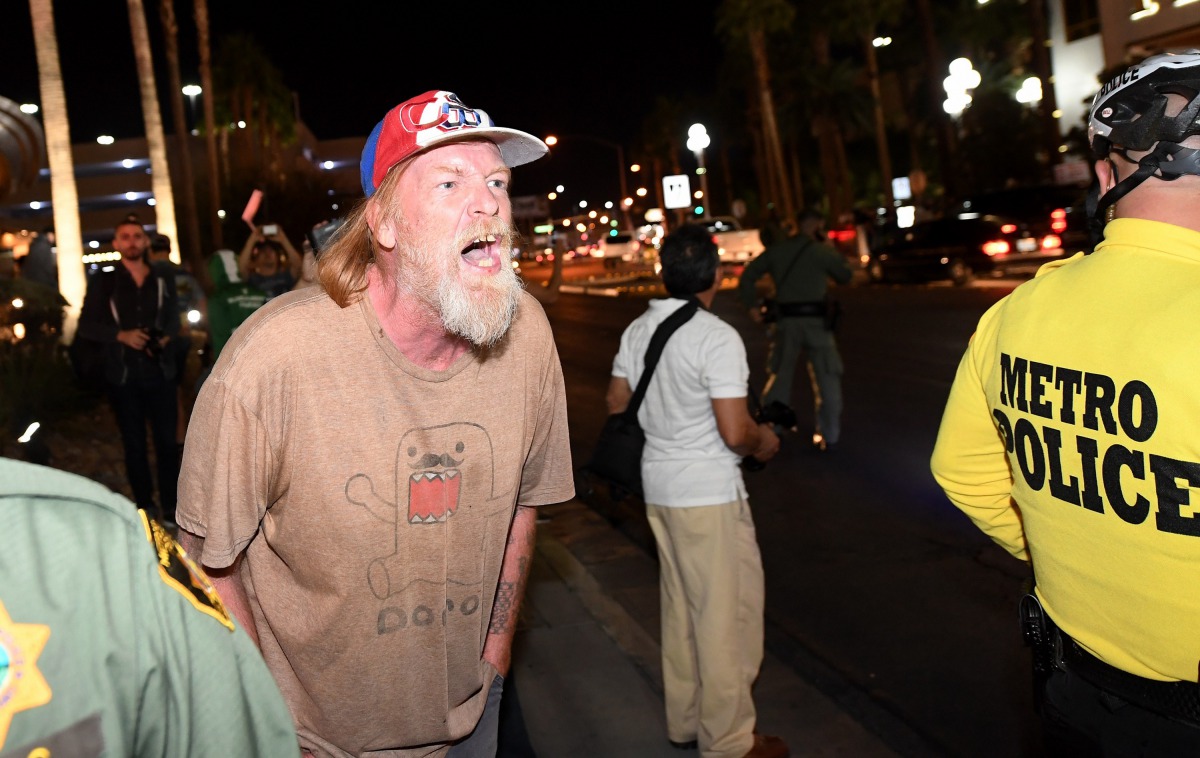 FILE PHOTO: A Donald Trump supporter yells at anti-Trump protesters outside the Trump International Hotel, Las Vegas. (Ethan Miller /Getty Images /AFP) 