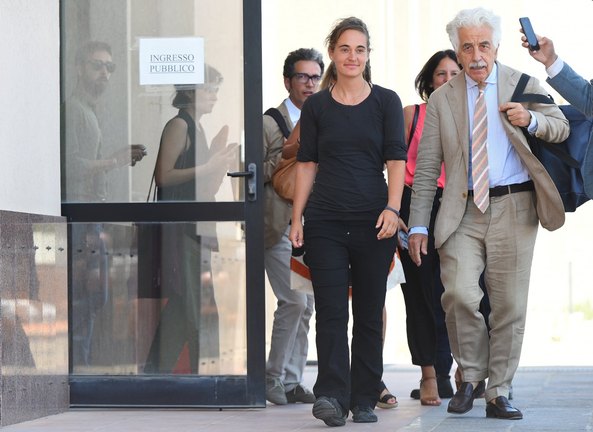 German captain Carola Rackete leaves the court, accompanied by her lawyer Alessandro Gamberini, after a hearing over accusations she aided illegal immigration in Agrigento, Sicily, Italy July 18, 2019. Reuters/Guglielmo Mangiapane