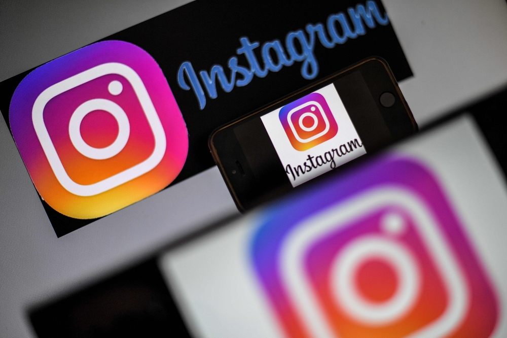 In this file photo taken on May 2, 2019 logos of US social network Instagram are displayed on a screen of a smartphone in Nantes, western France.  AFP / Loic Venance 