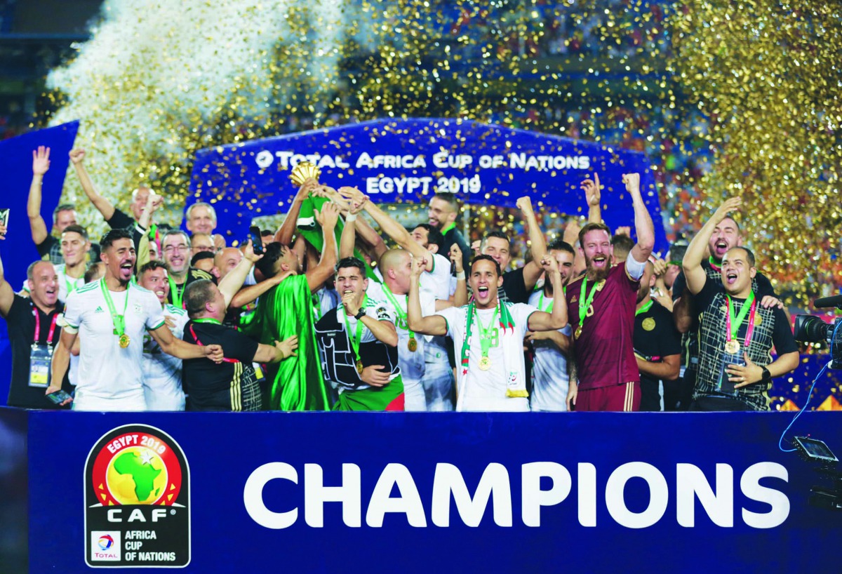 Algerian players and officials celebrate with the trophy after winning the 2019 Africa Cup of Nations title at the Cairo Stadium in Cairo, Egypt on Friday. Algeria sealed  their first Africa Cup of Nations (AFCON) title in 29 years, beating Senegal 1-0.