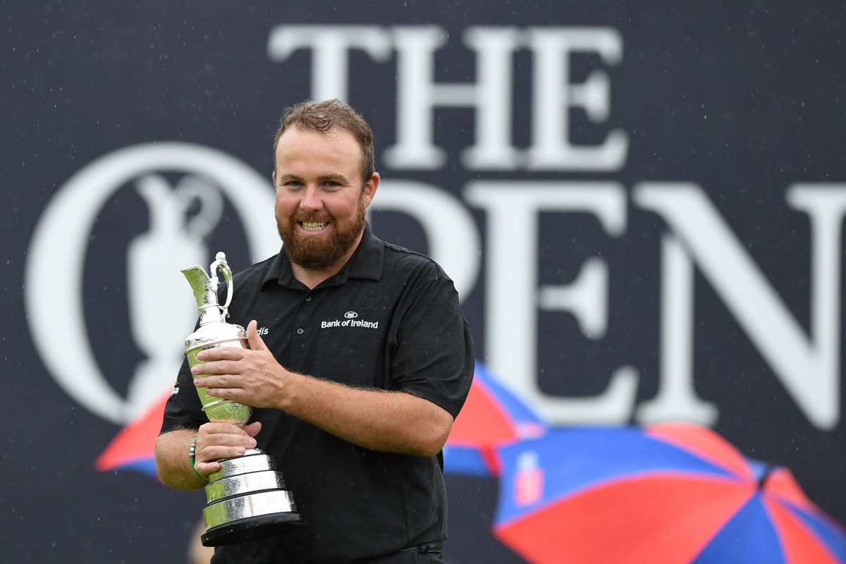 Ireland's Shane Lowry poses with the Claret Jug, the trophy for the Champion golfer of the year after winning the British Open golf Championships at Royal Portrush golf club in Northern Ireland on July 21, 2019. AFP / Glyn Kirk 