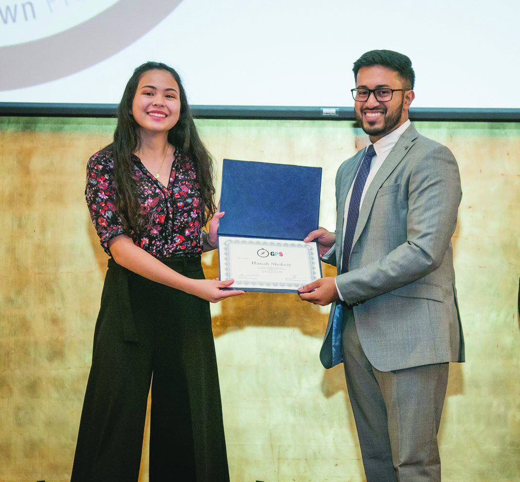 Jibin Koshy (right), Educational Enrichment Manager at GU-Q,  with GPS participant Hanah Shokeir, a year-12 student at Doha College, at the closing ceremony.