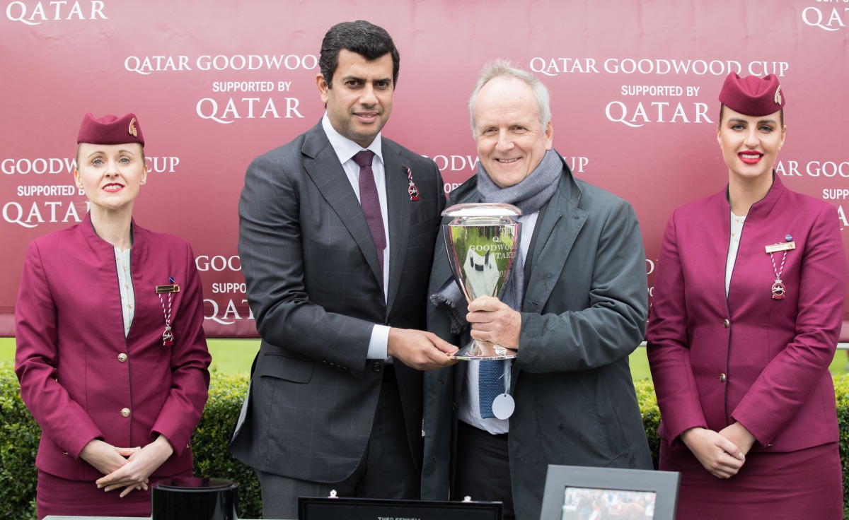The President of Qatar and Asian Equestrian Federations, Hamad bin Abdulrahman Al Attiyah (second, left), presenting the Qatar Goodwood Stakes trophy to the owner of Stradivarius, Bjorn Nielsen, on the opening day of the QREC-sponsored Qatar Goodwood Fest