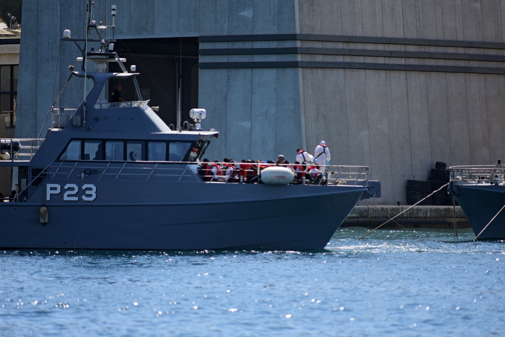A patrol boat carrying migrants rescued by the Alan Kurdi vessel enters the Maltese harbour, Malta August 4, 2019. REUTERS/Mark Zammit Cordina