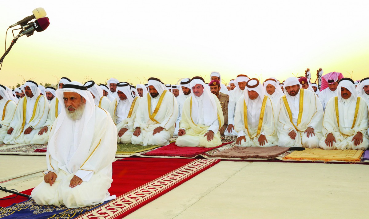 Amir H H Sheikh Tamim bin Hamad Al Thani performing Eid Al Adha prayer along with Their Excellencies the Ministers, Sheikhs, diplomats and a group of loyal citizens at Al Wajba praying area yesterday.