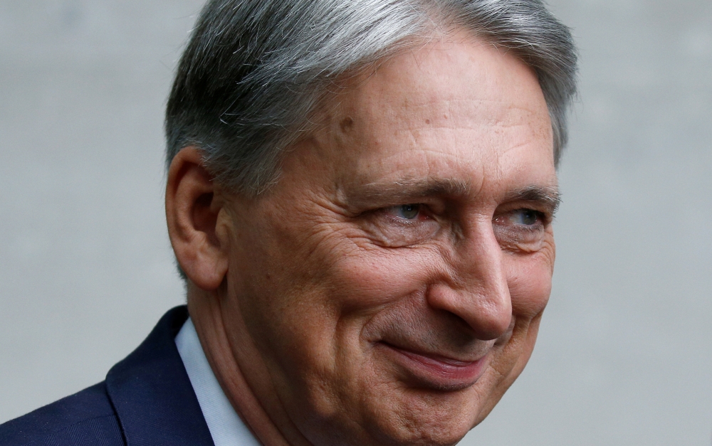 FILE PHOTO: Britain's Chancellor of the Exchequer Philip Hammond leaves the BBC studios in London, Britain, July 21, 2019. REUTERS/Henry Nicholls/File Photo