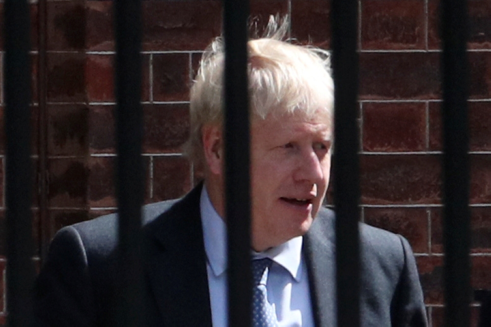 Britain's Prime Minister Boris Johnson is seen at the back of Downing Street in London, Britain, August 21, 2019. REUTERS/Hannah McKay