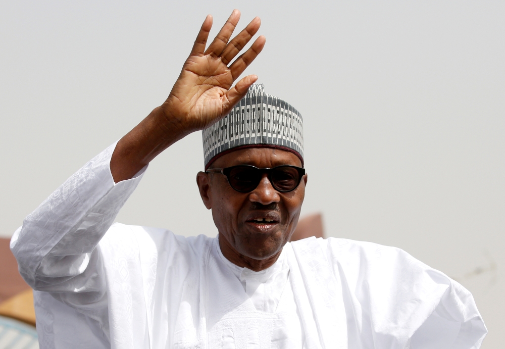 FILE PHOTO: Nigeria's President Muhammadu Buhari greets his supporters after Friday prayers in his hometown Daura, in Katsina State, ahead of the country's presidential election, Nigeria February 15, 2019. REUTERS/Luc Gnago