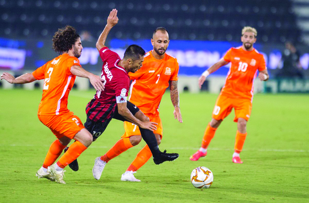 Al Rayyan skipper Rodrigo Tabata (centre) is challenged by Umm Salal players during their QNB Stars League match played at the Al Sadd Stadium, yesterday. 