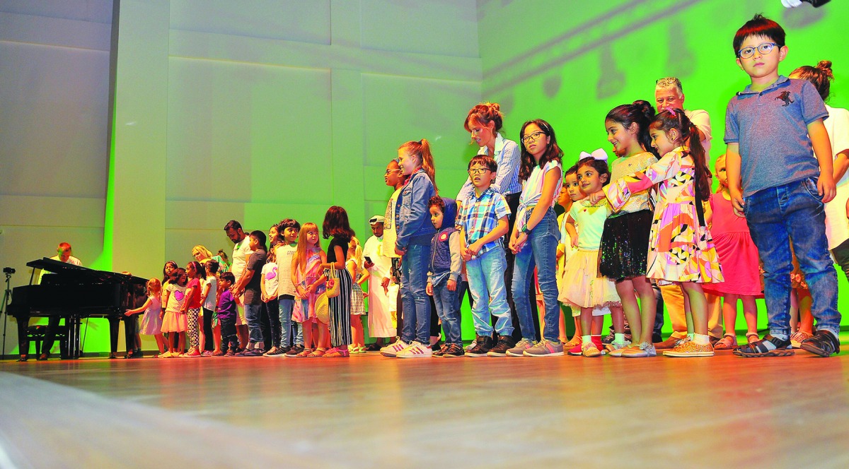 Young children taking part in a workshop conducted by Greg Arrowsmith, a musical director from the West End for the London Palladium pantomimes, and Joanne Corrigan, an experienced ex-BBC live programme editor and producer, at the Hamilton International S