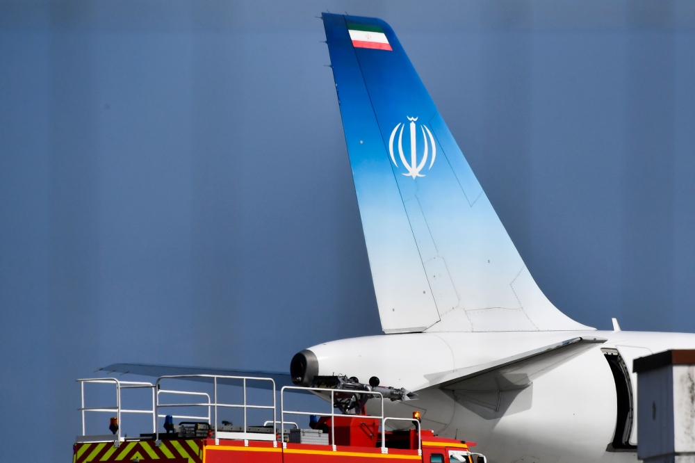 The air-plane which carried Iran's Foreign Minister Mohammad Javad Zarif stands on the tarmac at the airport of the French seaside resort of Biarritz, south-west France, during the G7 summit in Biarritz, on August 25, 2019, on the second day of the annual