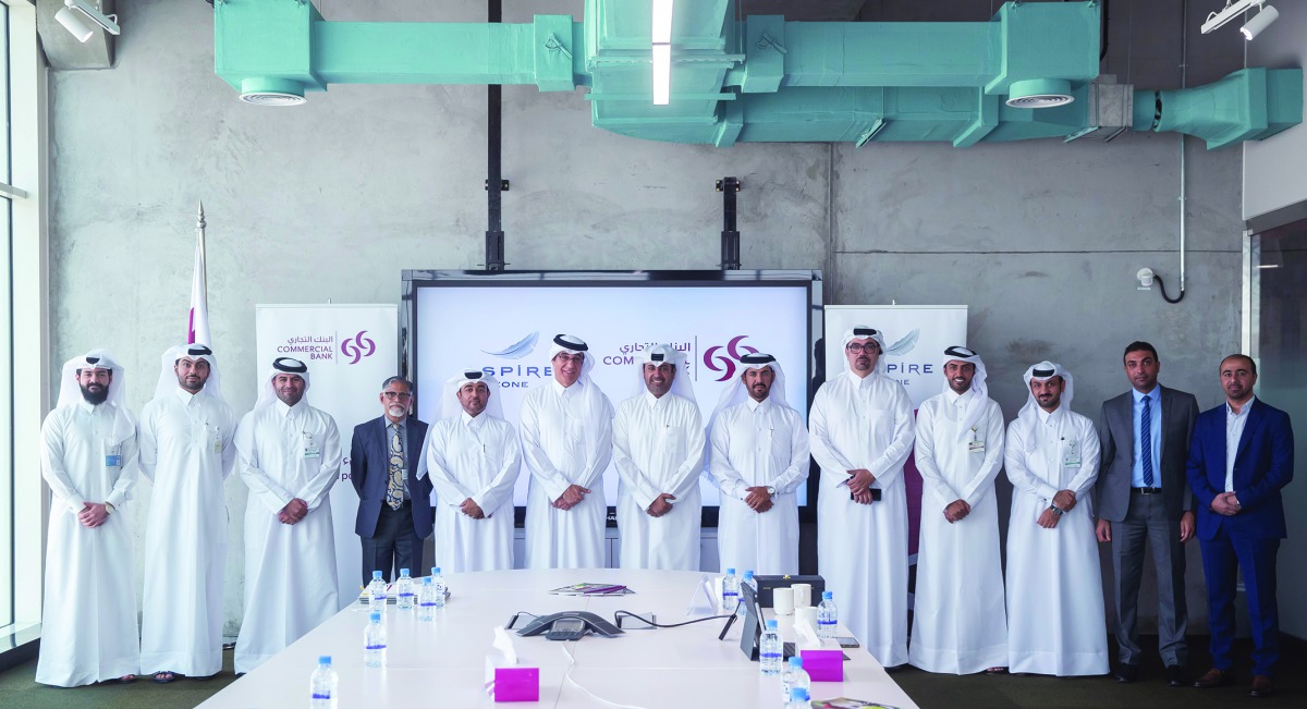 The officials of the Commercial Bank and Aspire Zone Foundation during the signing of the contract. 