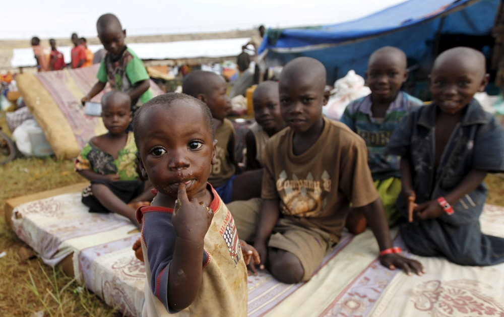 FILE PHOTO: Burundian refugee children pose for a photograph at the Lake Tanganyika stadium in Kigoma western Tanzania, May 19, 2015. REUTERS/Thomas Mukoya