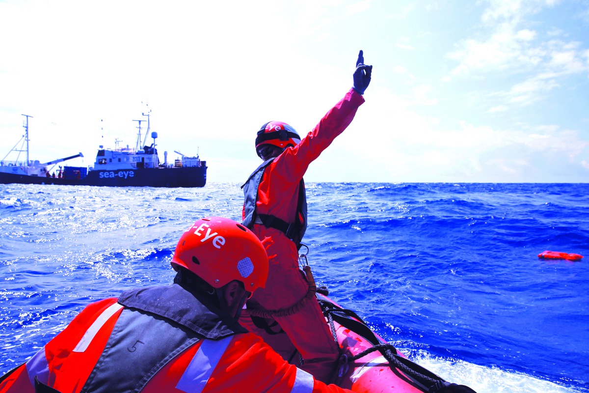 Crew members of the German NGO Sea-Eye migrant rescue ship 'Alan Kurdi' take part in a training exercise while on their way to the search and rescue zone off the North African coast, in the western Mediterranean Sea, August 29, 2019. Reuters/Darrin Zammit