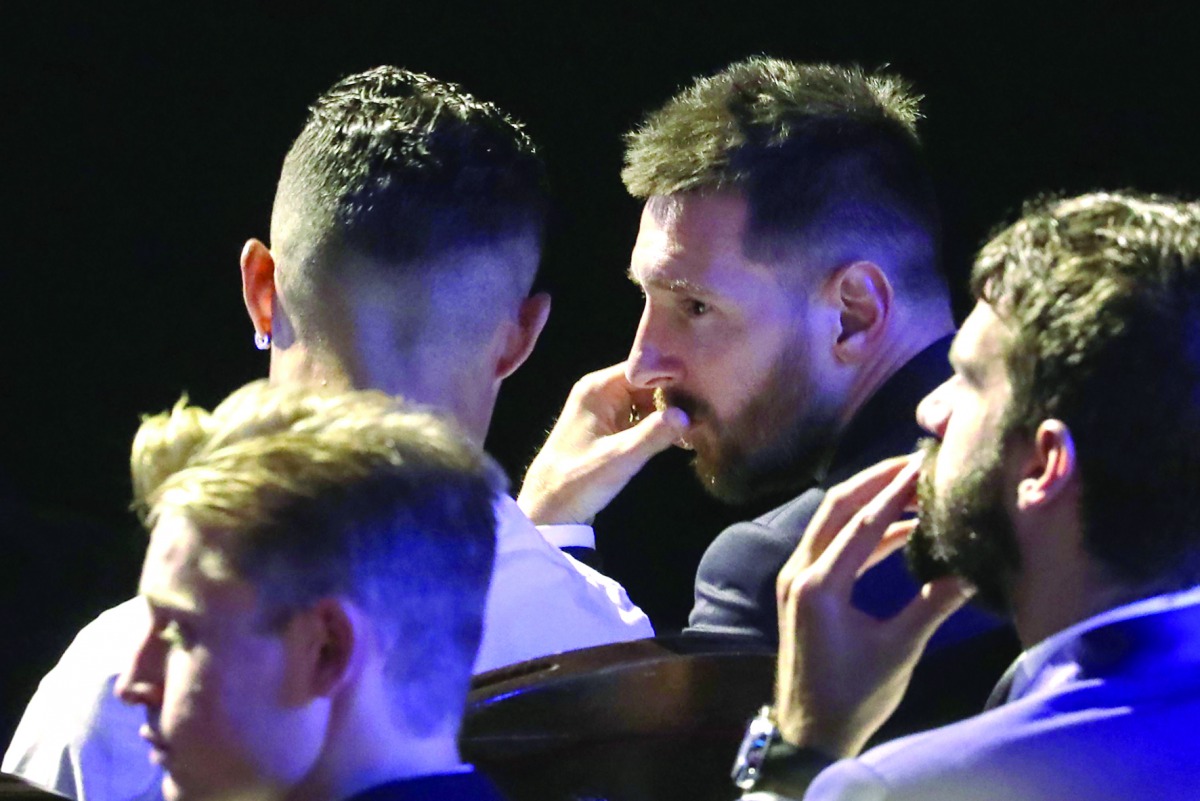 Argentine forward Lionel Messi (R) speaks with Portuguese forward Cristiano Ronaldo (L) during the UEFA Champions League football group stage draw ceremony in Monaco on August 29, 2019. AFP / Valery Hache
